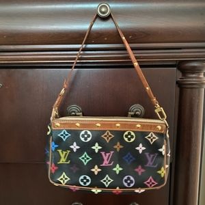 Authentic Louis Vuitton wrist handbag.